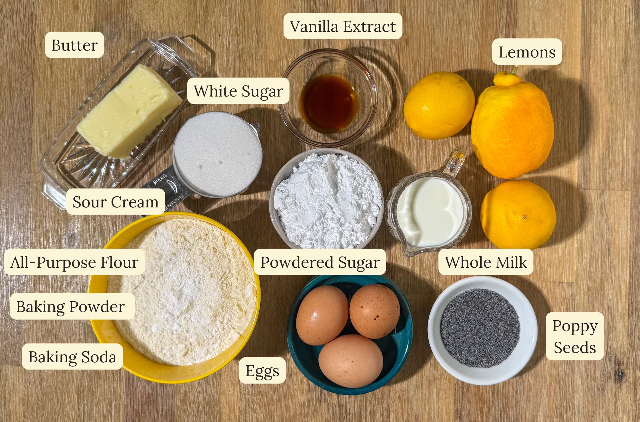 Ingredients laid out on a table for the glazed lemon poppy seed loaf