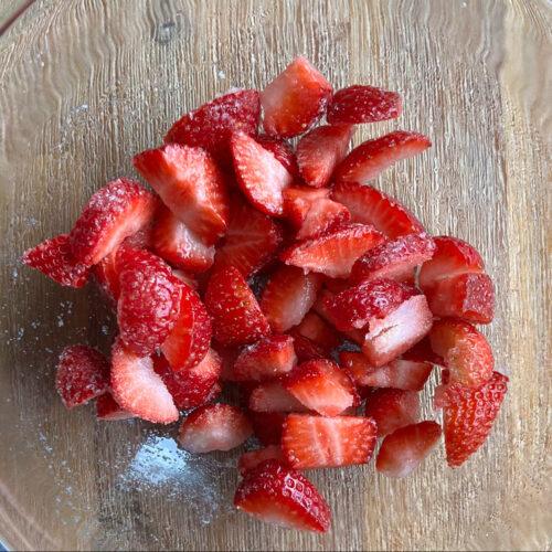 Macerated Strawberries 7 chopped strawberries with white sugar in a glass bowl