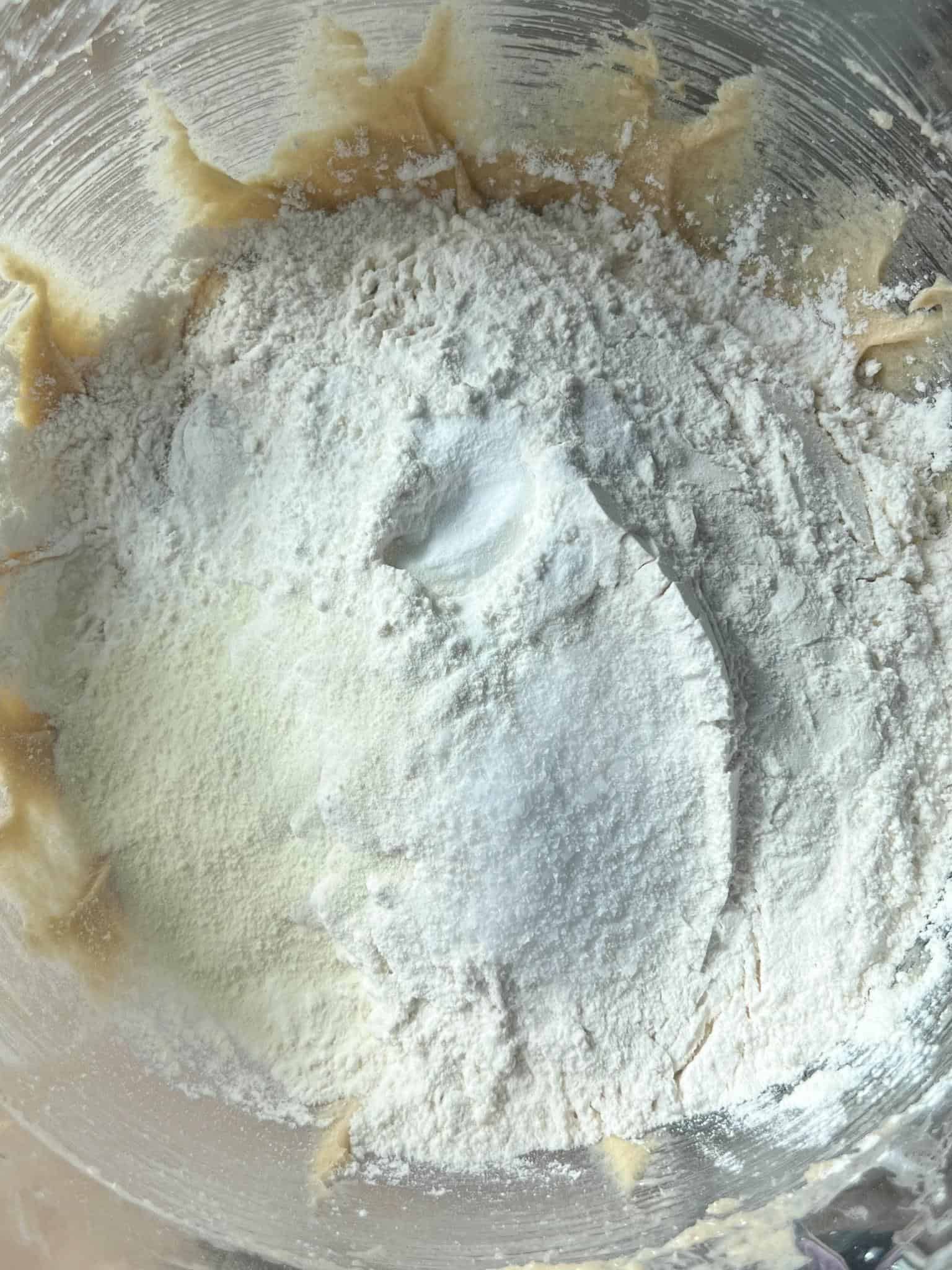 Oreo Cheesecake Cookies (Stuffed!) 6 Dry ingredients in a glass mixing bowl on top of the wet ingredients