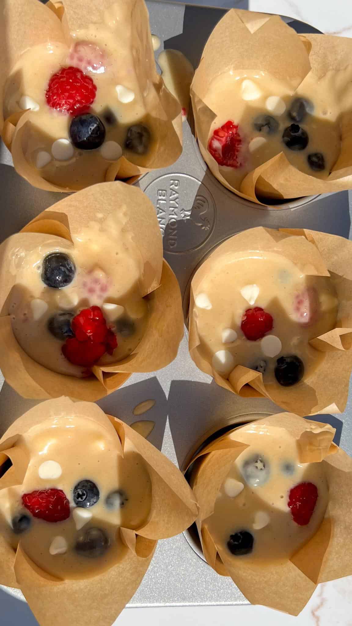 Raspberry Blueberry White Chocolate Muffins (red white and blue!) 9 Muffin batter in the tin