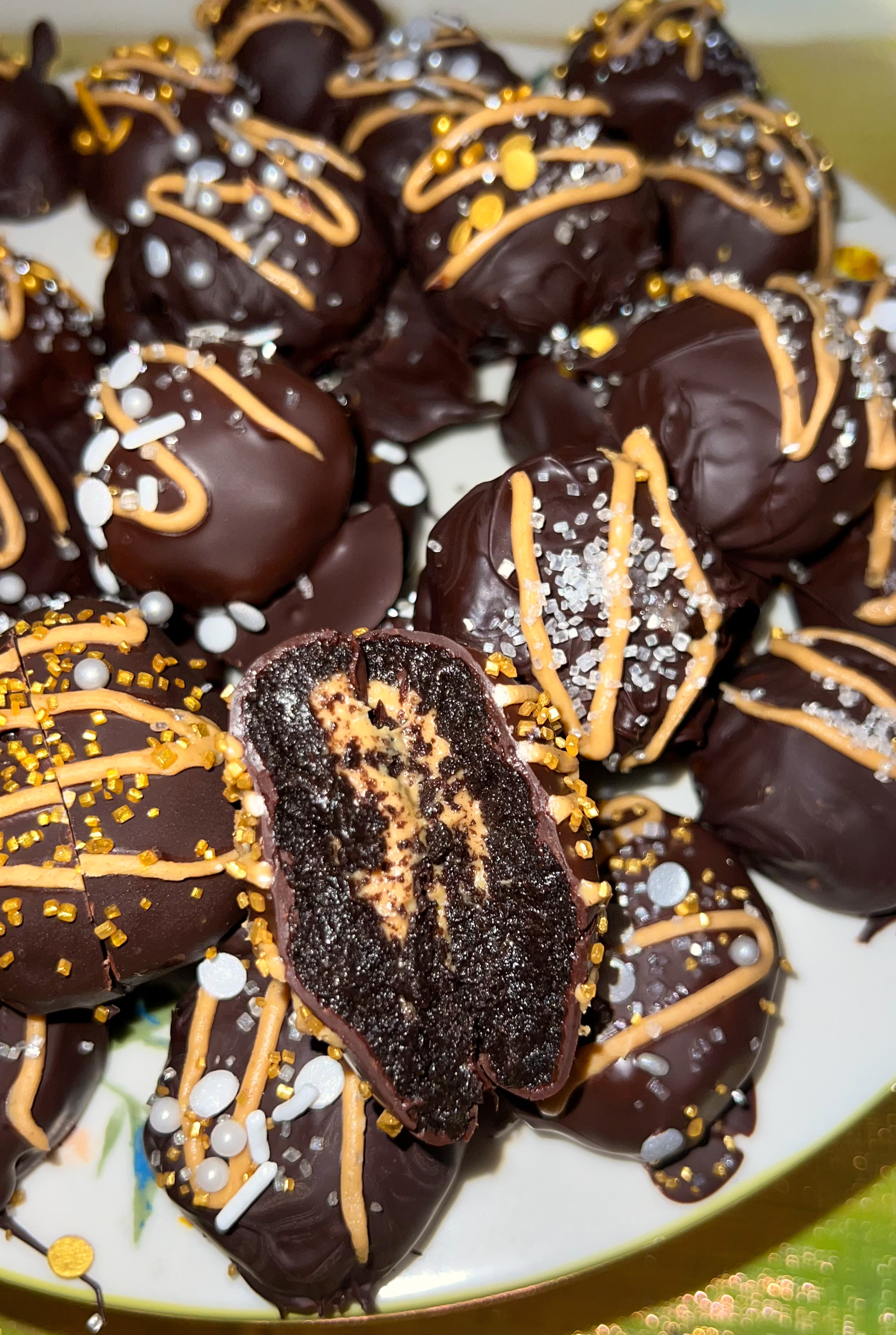 Peanut Butter Oreo Truffles 6 Delicious and gooey Oreo peanut butter truffles plated.