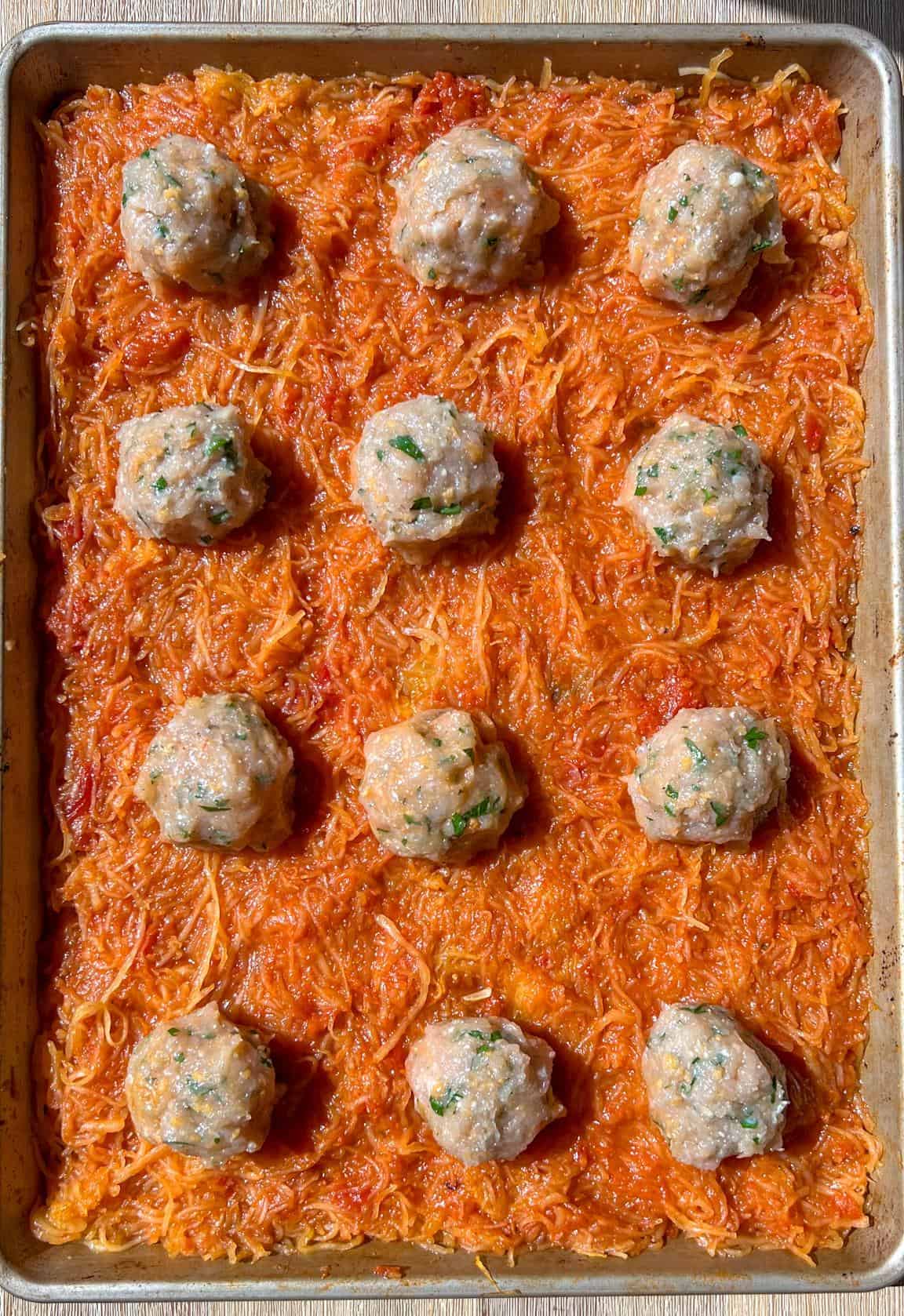 One-Pan Spaghetti Squash and Meatballs 4 sheet pan spaghetti squash with meatballs placed over
