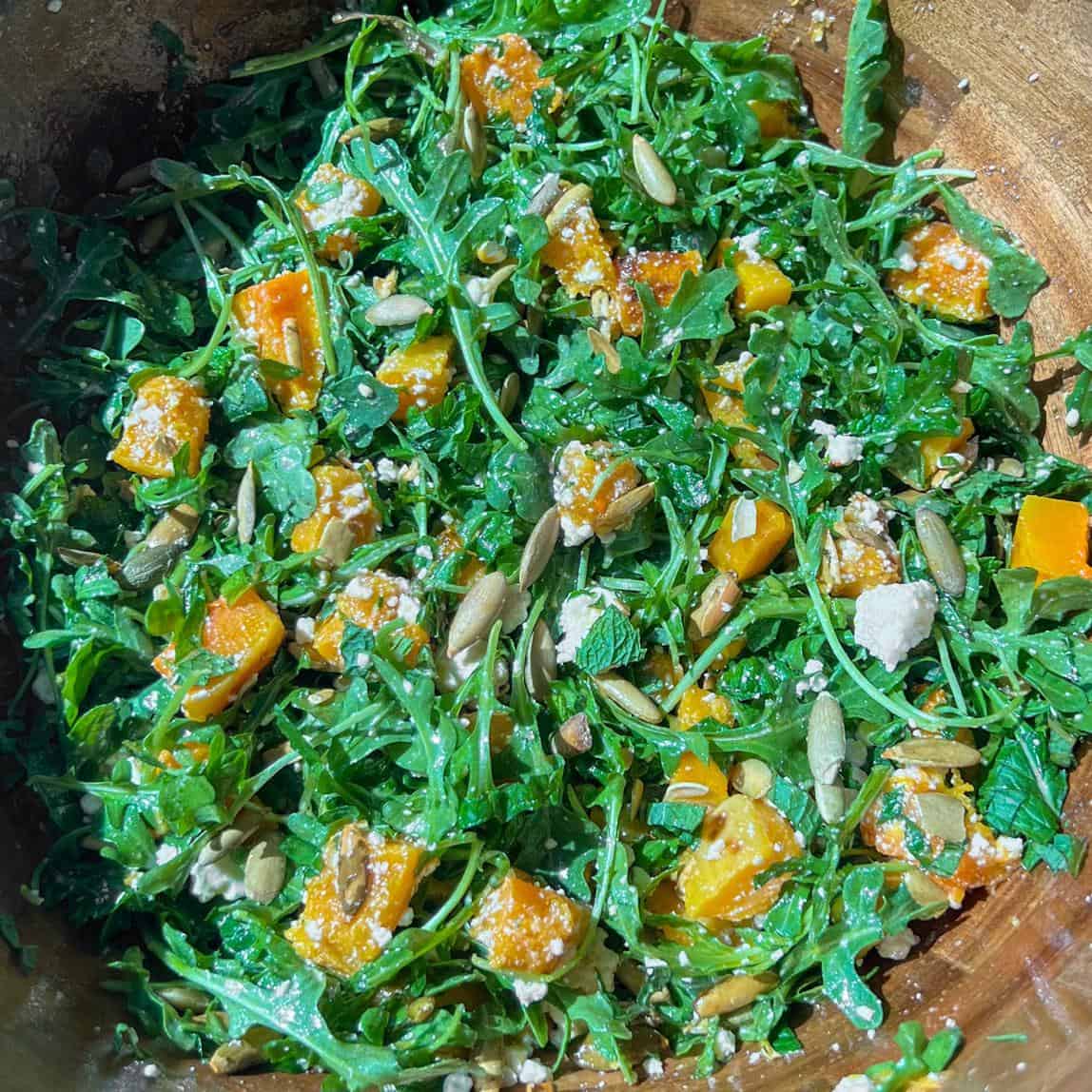 Hot Honey Butternut Squash Salad 4 Hot honey butternut squash salad all mixed up in a wooden bowl.