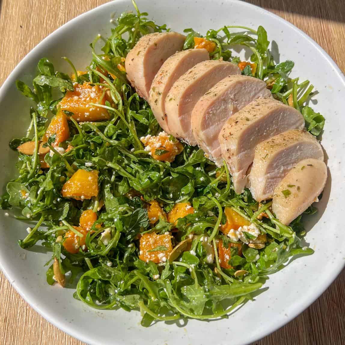 Hot Honey Butternut Squash Salad 6 Hot honey butternut squash salad all mixed up on a salad bowl served with chicken breast.