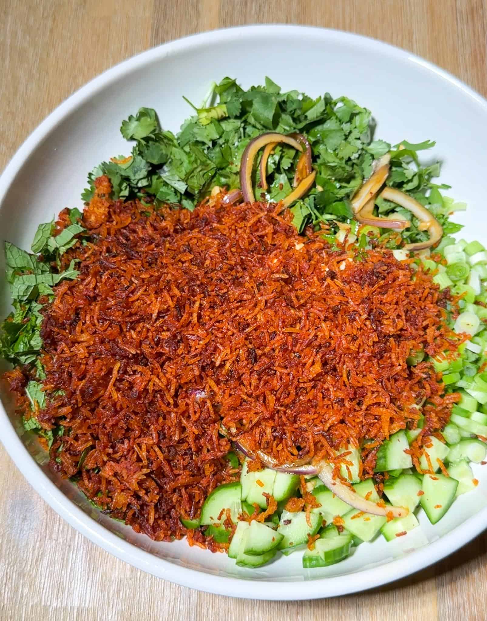 Thai Crispy Rice Salad 3 Crispy thai red curry rice over a bed of herbs and cucumbers for the salad