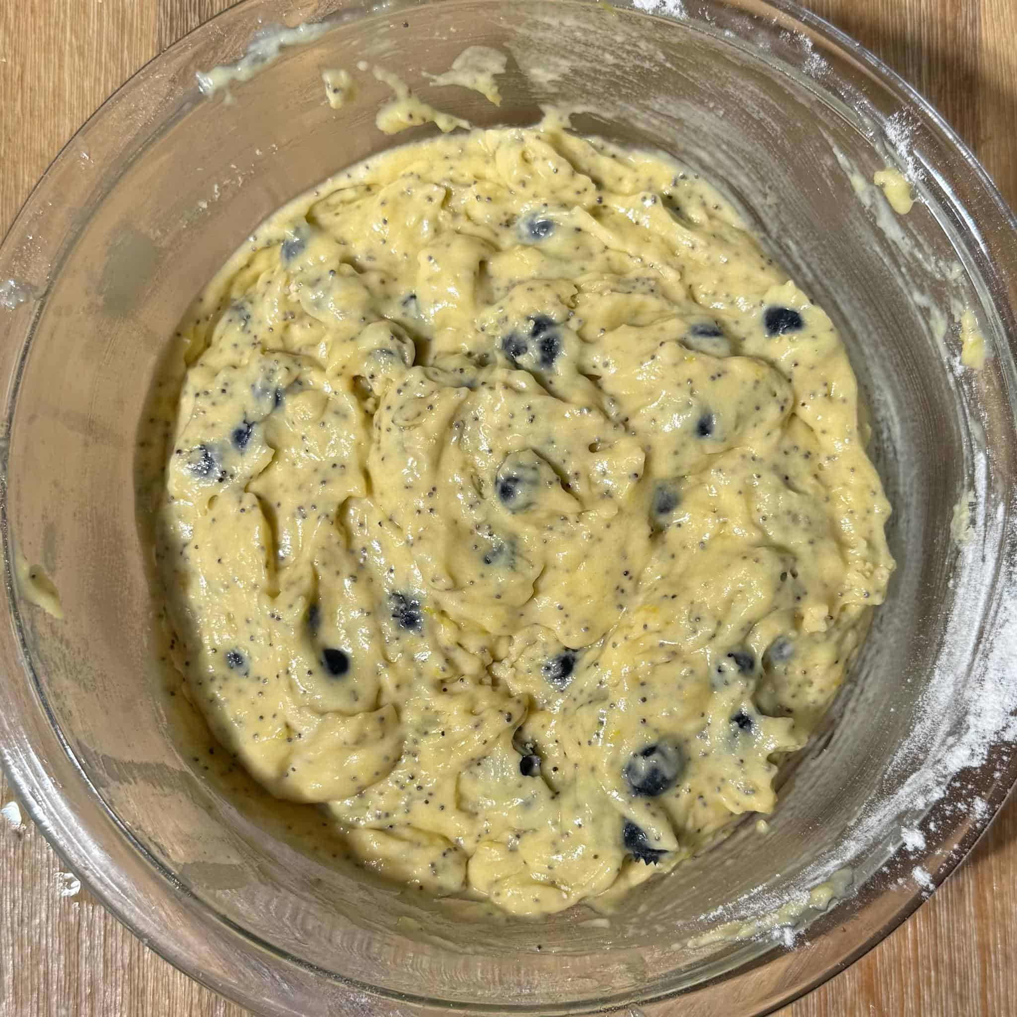 Blueberry Lemon Poppyseed Muffins 6 Blueberry lemon poppy seed muffin batter in a glass bowl