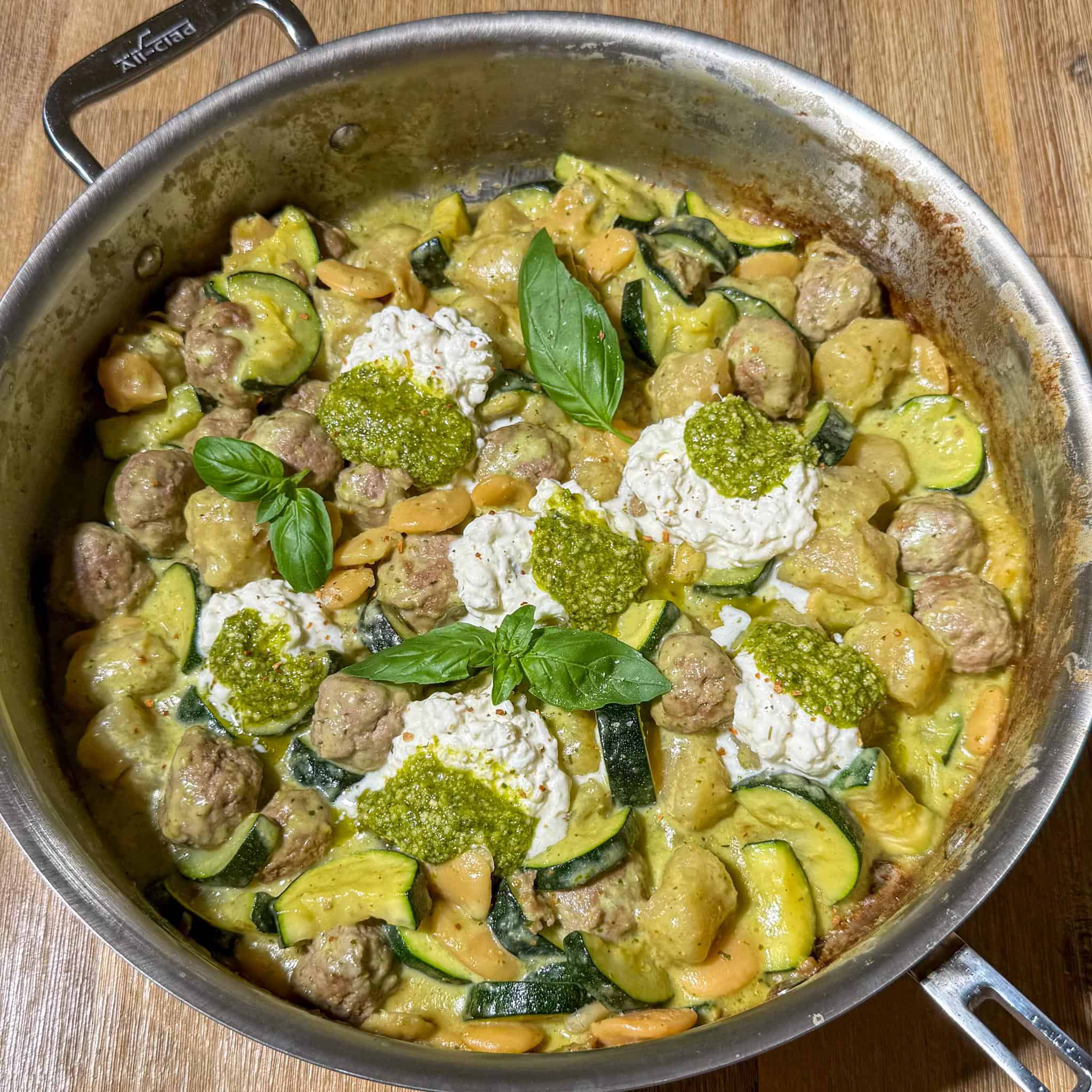 Healthy Pesto Gnocchi and Meatballs 10 Spoonful of pesto added on top of each stracciatella dollop with some basil scattered too