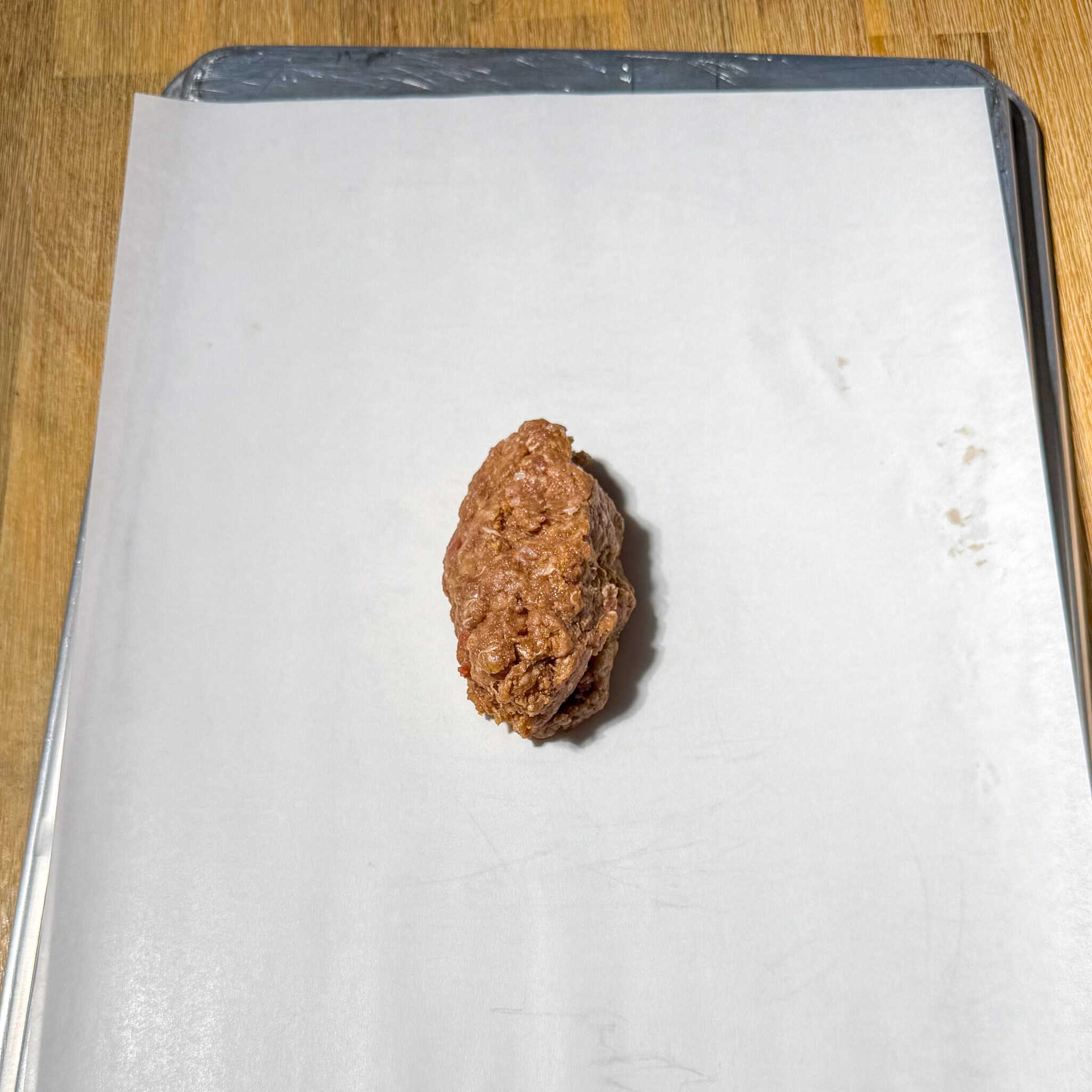One serving of the meat mixture on a sheet tray