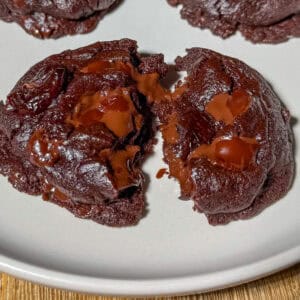 Delicious homemade triple chocolate cherry cookie with a rich, gooey center, perfect for snacking or dessert.