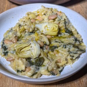 Plate of high fiber spinach artichoke orzo