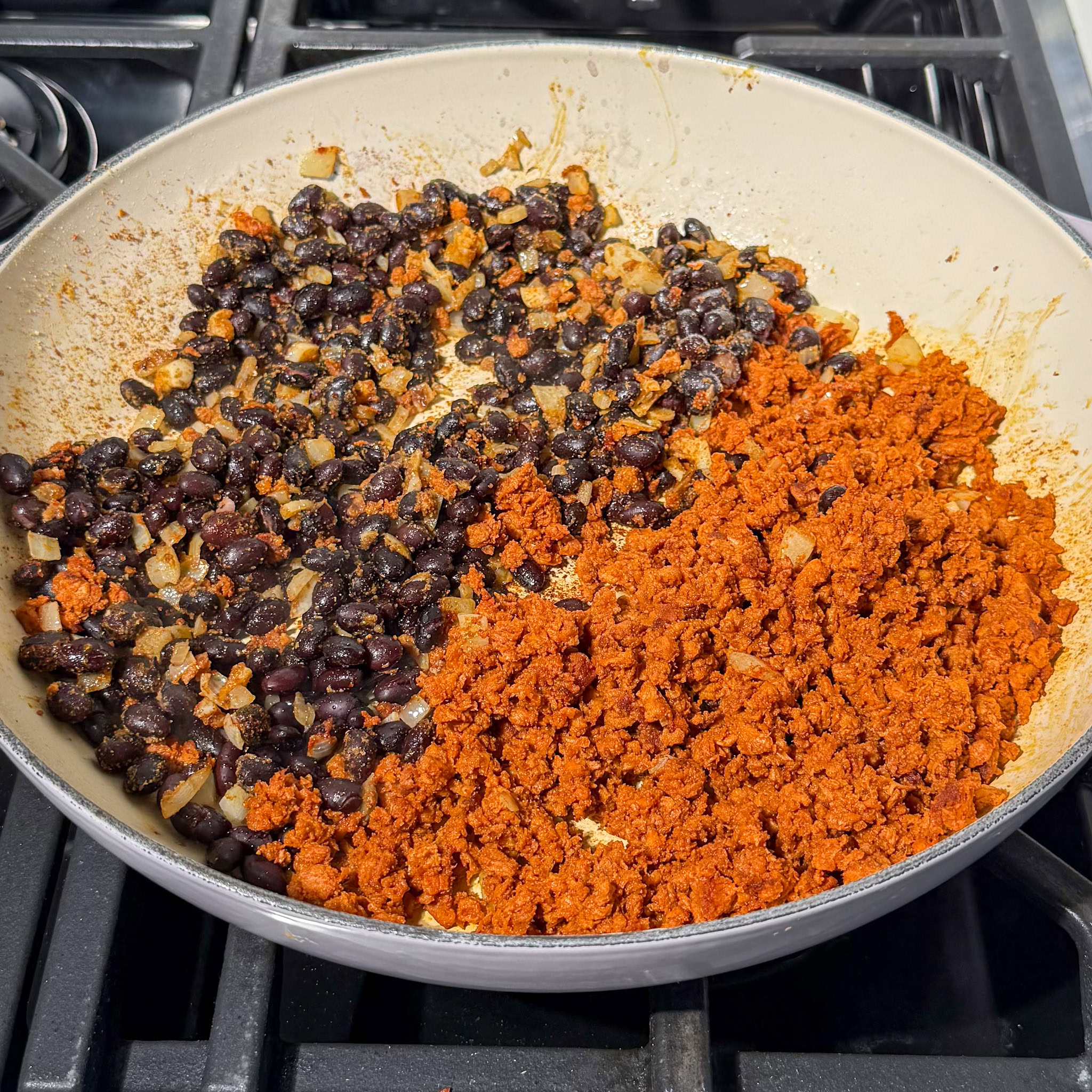 black beans and soyrizo cooking in a pan before being mixed together