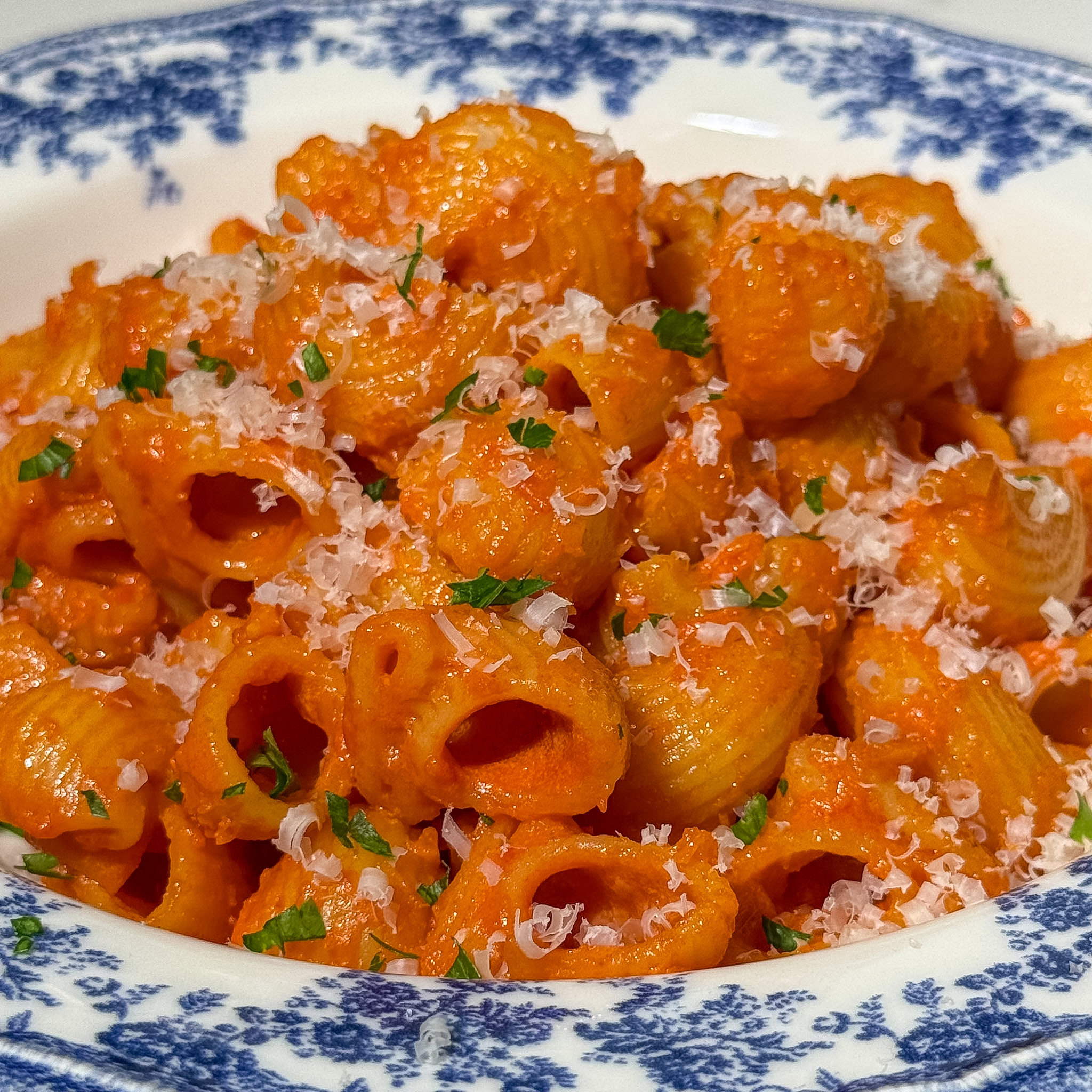 Healthy Pasta Alla Vodka Sauce 2 Close up of plated healthy pasta alla vodka with freshly grated parmesan and parsley on top