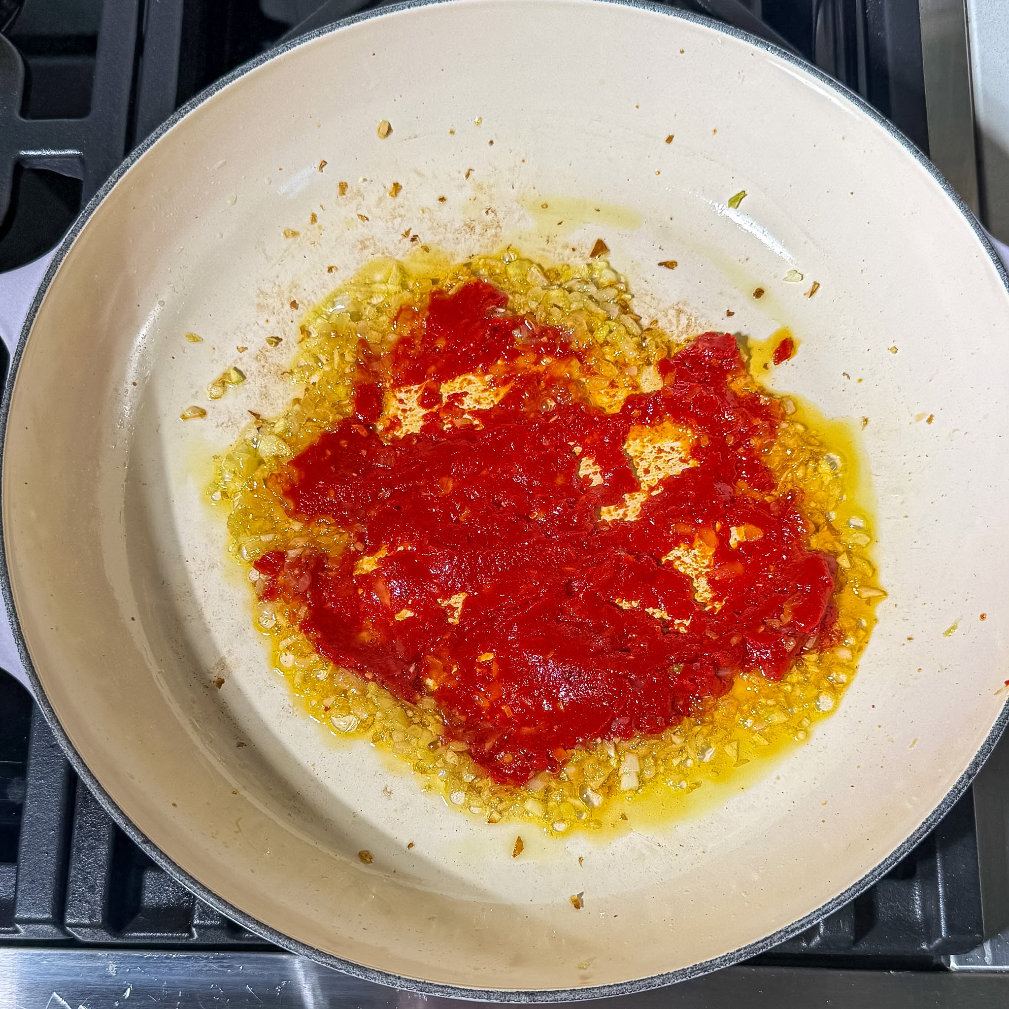 Healthy Pasta Alla Vodka Sauce 6 caramelizing tomato paste on a pan